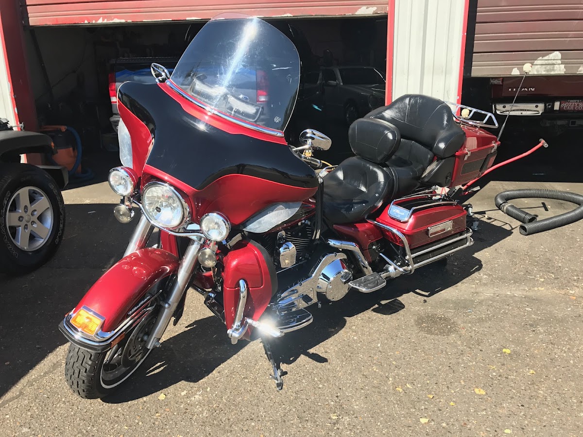 A detailed red motorcycle outside the Arredondo shop